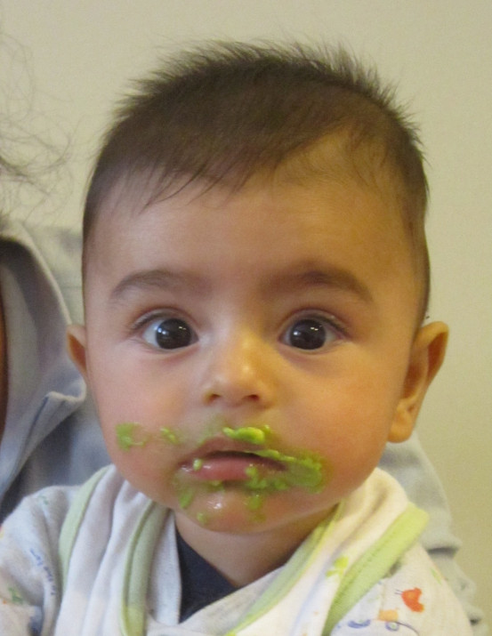 Ayhan trying mashed peas for the first time.